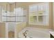 Spa-like bathroom with soaking tub and walk-in shower at 12706 Lake Silver Ave, Bradenton, FL 34211