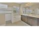Elegant bathroom with a double vanity, soaking tub, and walk-in shower at 12706 Lake Silver Ave, Bradenton, FL 34211