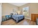 Bright bedroom with ample closet space and wood-look floors at 12706 Lake Silver Ave, Bradenton, FL 34211