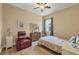 Cozy bedroom with a comfortable seating area and large windows at 12706 Lake Silver Ave, Bradenton, FL 34211