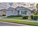 One-story house with nicely landscaped yard and a two-car garage at 12706 Lake Silver Ave, Bradenton, FL 34211