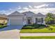 Well maintained home with lush landscaping and inviting front porch at 12706 Lake Silver Ave, Bradenton, FL 34211