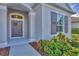 Inviting front door with decorative wreath and sidelights at 12706 Lake Silver Ave, Bradenton, FL 34211