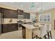 Modern kitchen with dark cabinetry, quartz countertops, and stainless steel appliances at 12706 Lake Silver Ave, Bradenton, FL 34211