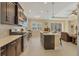 Modern kitchen with dark cabinetry, quartz countertops and stainless steel appliances at 12706 Lake Silver Ave, Bradenton, FL 34211