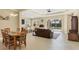 Open-concept living space with adjacent kitchen and pool view at 12706 Lake Silver Ave, Bradenton, FL 34211