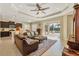 Spacious living area featuring a leather sofa and access to a lanai at 12706 Lake Silver Ave, Bradenton, FL 34211