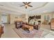Spacious living room featuring a comfortable leather sofa and a large area rug at 12706 Lake Silver Ave, Bradenton, FL 34211