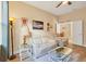 Cozy sitting room with light colored sofa and a glass top coffee table at 12706 Lake Silver Ave, Bradenton, FL 34211
