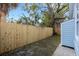 Backyard with a wooden fence and a small shed at 1305 11Th W Ave, Bradenton, FL 34205