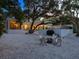 Relaxing backyard with a fire pit and lounge chairs at 1331 Quail Dr, Sarasota, FL 34231