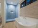 Bathroom with blue tile shower and freestanding bathtub at 1331 Quail Dr, Sarasota, FL 34231