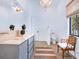 Bathroom with double vanity, walk-in shower, and separate toilet area at 1331 Quail Dr, Sarasota, FL 34231