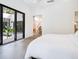 Bright bedroom with sliding glass doors opening to a private patio at 1331 Quail Dr, Sarasota, FL 34231