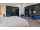 Bright bedroom with white bedding and sliding glass doors leading to patio at 1331 Quail Dr, Sarasota, FL 34231