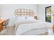 Bedroom with a unique headboard, and plenty of natural light at 1331 Quail Dr, Sarasota, FL 34231