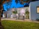 Modern home exterior, featuring a pink door and a two-car garage at 1331 Quail Dr, Sarasota, FL 34231