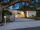 Stunning curb appeal with gated entry and lush landscaping at 1331 Quail Dr, Sarasota, FL 34231