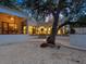 Home exterior showcasing modern design and a large tree at 1331 Quail Dr, Sarasota, FL 34231
