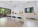 Modern kitchen with island, stainless steel appliances, and access to backyard at 1331 Quail Dr, Sarasota, FL 34231