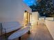 Private patio with seating area and views of the surrounding landscape at 1331 Quail Dr, Sarasota, FL 34231