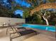 Inviting swimming pool with lounge chairs and outdoor seating area at 1331 Quail Dr, Sarasota, FL 34231