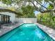 Modern rectangular pool with a concrete deck and plenty of sun at 1331 Quail Dr, Sarasota, FL 34231