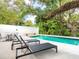 Inviting swimming pool with lounge chairs and lush landscaping at 1331 Quail Dr, Sarasota, FL 34231