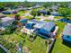 Aerial view of a charming house with a newly landscaped backyard and patio at 138 Paddington Rd, Venice, FL 34293