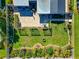 Overhead view of a backyard oasis with a patio, garden, and pergola at 138 Paddington Rd, Venice, FL 34293