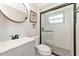 Updated bathroom with gray vanity and walk-in shower at 138 Paddington Rd, Venice, FL 34293