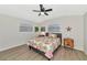 Bedroom with a queen bed, nightstands, and ceiling fan at 138 Paddington Rd, Venice, FL 34293