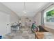 Spacious bonus room with tile floor, work table, and laundry access at 138 Paddington Rd, Venice, FL 34293