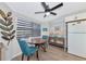 Cozy breakfast nook with a round table and two teal chairs at 138 Paddington Rd, Venice, FL 34293
