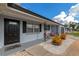 Inviting front porch with seating area and attractive landscaping at 138 Paddington Rd, Venice, FL 34293