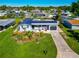 Single story home with pool and landscaped yard at 138 Paddington Rd, Venice, FL 34293