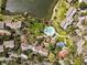 Aerial view of the complex featuring multiple pools, buildings, landscaping and serene surroundings at 1519 Pelican Point Dr # 292, Sarasota, FL 34231
