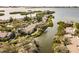 Aerial view of waterfront community with lush landscaping and boat slips at 1519 Pelican Point Dr # 292, Sarasota, FL 34231