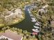 Aerial view of the community marina with homes, docks and boats at 1519 Pelican Point Dr # 292, Sarasota, FL 34231