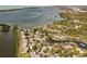 Aerial view showing waterfront community with boat slips and lush landscaping at 1519 Pelican Point Dr # 292, Sarasota, FL 34231