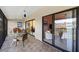Covered balcony with tile floor, seating and direct access to the main living area at 1519 Pelican Point Dr # 292, Sarasota, FL 34231