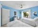 Bright bedroom with twin beds, natural light, desk, decor and an airy atmosphere at 1519 Pelican Point Dr # 292, Sarasota, FL 34231
