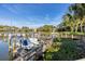 Boats docked at the community's wooden pier at 1519 Pelican Point Dr # 292, Sarasota, FL 34231