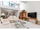 Comfortable living room with high ceilings and natural light at 1519 Pelican Point Dr # 292, Sarasota, FL 34231