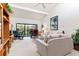 Cozy living room with view of the deck and comfortable seating arrangements at 1519 Pelican Point Dr # 292, Sarasota, FL 34231