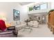 Inviting living room featuring high ceilings, comfortable seating, and ample natural light at 1519 Pelican Point Dr # 292, Sarasota, FL 34231