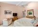 Bright main bedroom with a comfortable seating area, offering a tranquil retreat at 1519 Pelican Point Dr # 292, Sarasota, FL 34231