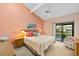 This lovely main bedroom has a balcony overlooking the waterfront at 1519 Pelican Point Dr # 292, Sarasota, FL 34231
