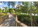 Community boardwalk path winds through lush foliage at 1519 Pelican Point Dr # 292, Sarasota, FL 34231