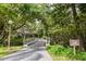 Scenic pathway leading to a wooden bridge over a serene waterway at 1519 Pelican Point Dr # 292, Sarasota, FL 34231